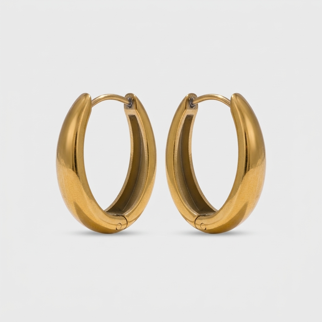 A pair of 18ct gold plated medical steel huggie hoop earrings featuring four interlocking bands, two plain gold and two with clear crystal pavé, creating a stacked look.