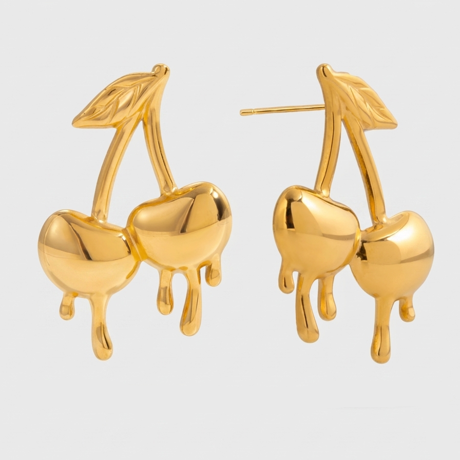 Gold-plated medical steel drop earrings in the shape of cherries with a unique melting or dripping gold effect. High-shine finish, hypoallergenic and waterproof.