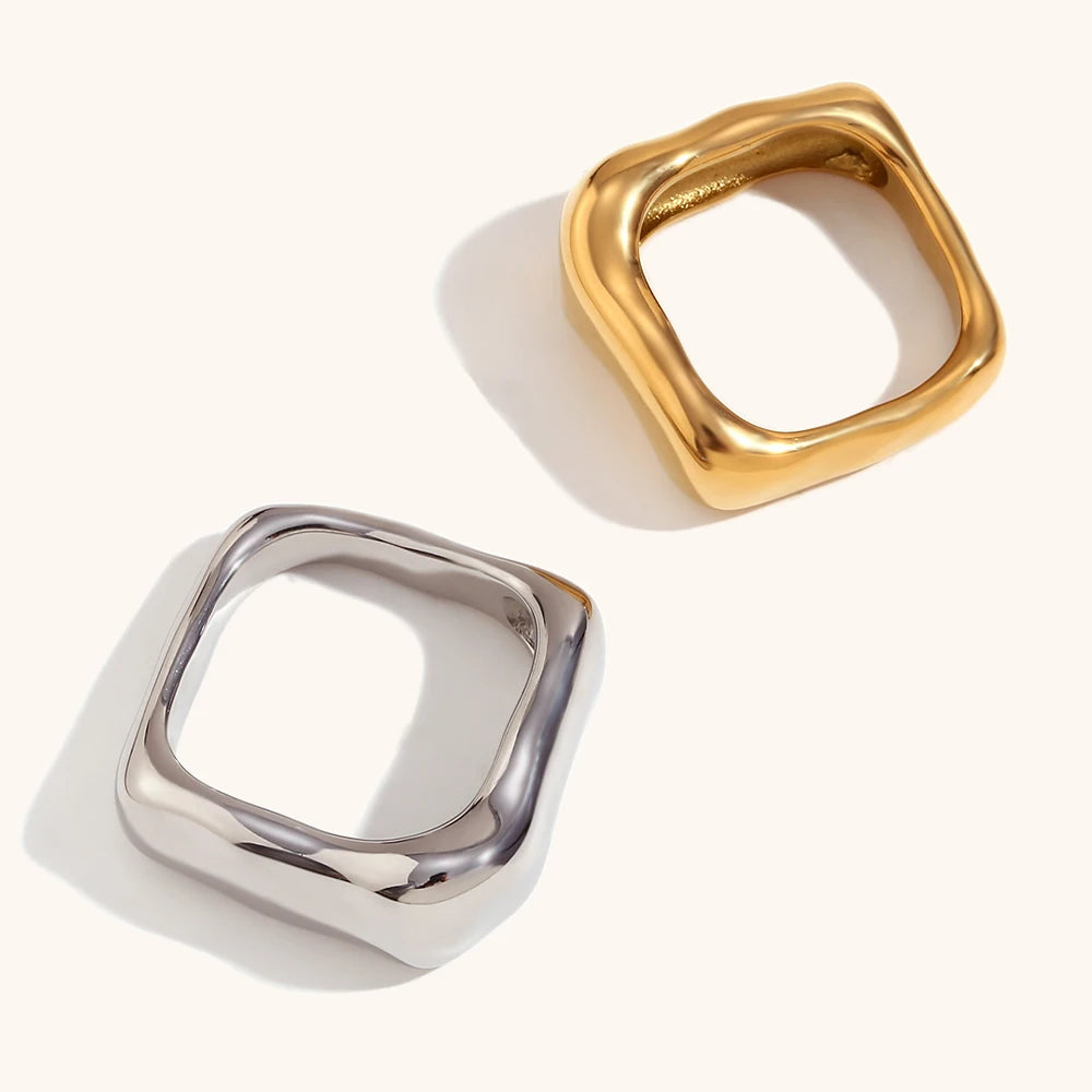 A wide, chunky dome ring in 18ct gold plated medical steel featuring a vertical ridged (fluted) texture on a high-shine polished surface.