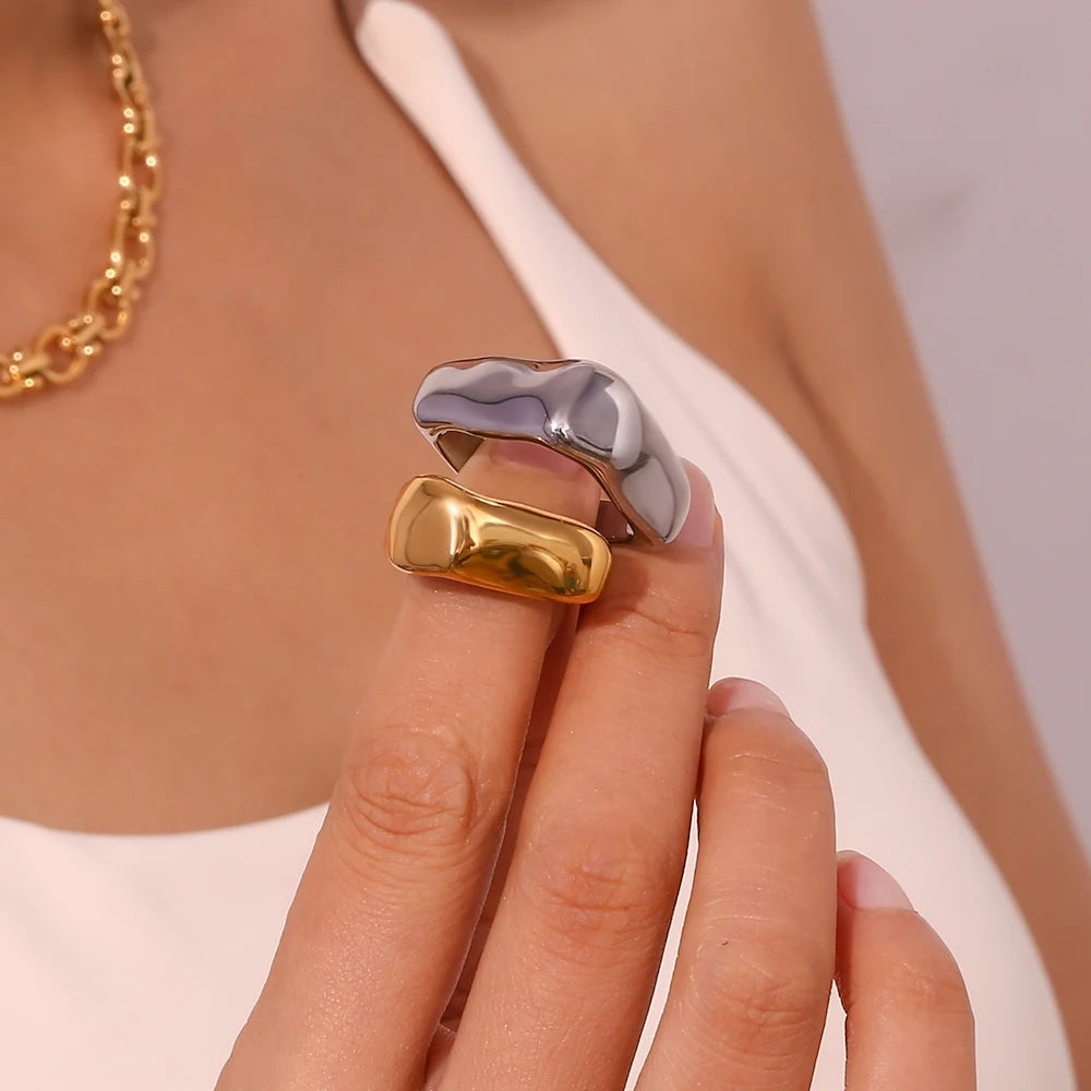 A wide, chunky dome ring in 18ct gold plated medical steel featuring a vertical ridged (fluted) texture on a high-shine polished surface.