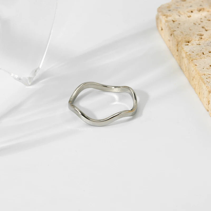 Elegant organic-shaped band crafted from tarnish-proof stainless steel. A versatile wavy ring perfect for a modern jewellery stack.