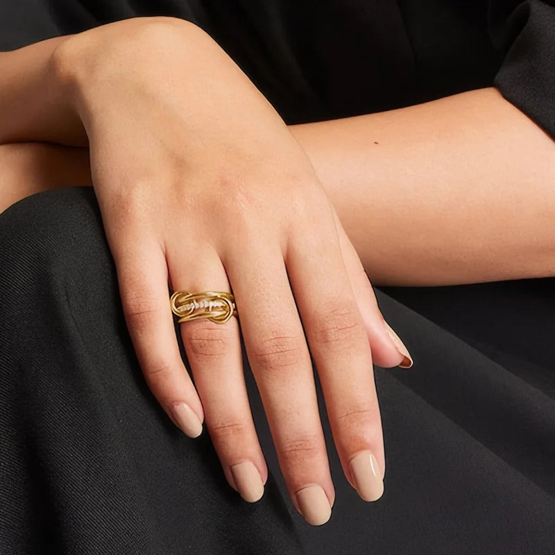 Stunning multi-layer linked ring crafted from hypoallergenic 18ct gold plated stainless steel. Polished and pave-set bands with sparkling crystals. Tarnish-proof British jewellery style.