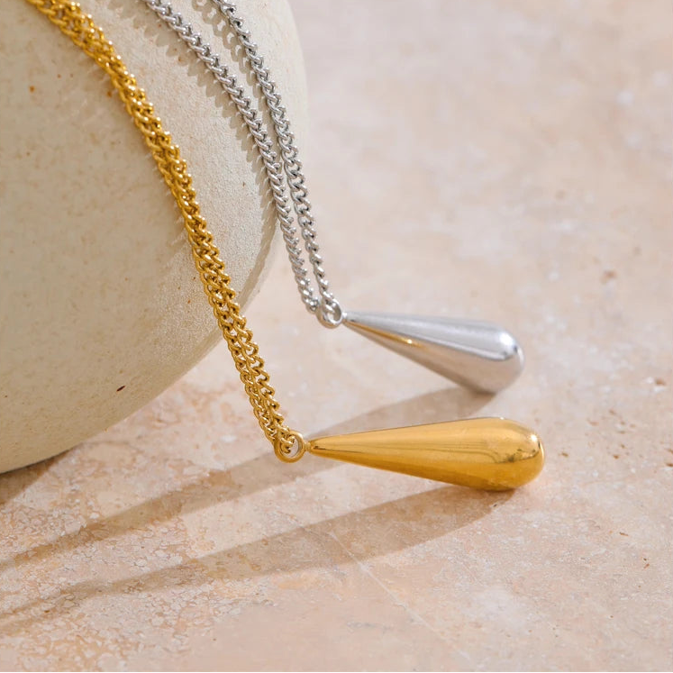 A flat 18ct gold plated medical steel snake chain necklace featuring a single polished gold ball pendant. High-shine finish, hypoallergenic and tarnish-proof.