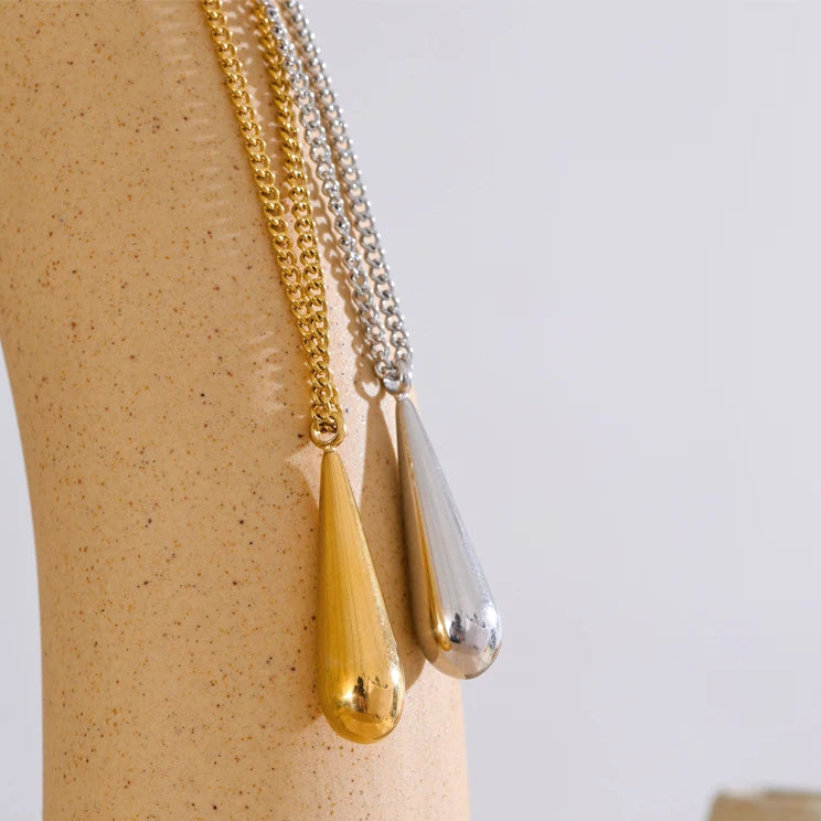 A flat 18ct gold plated medical steel snake chain necklace featuring a single polished gold ball pendant. High-shine finish, hypoallergenic and tarnish-proof.