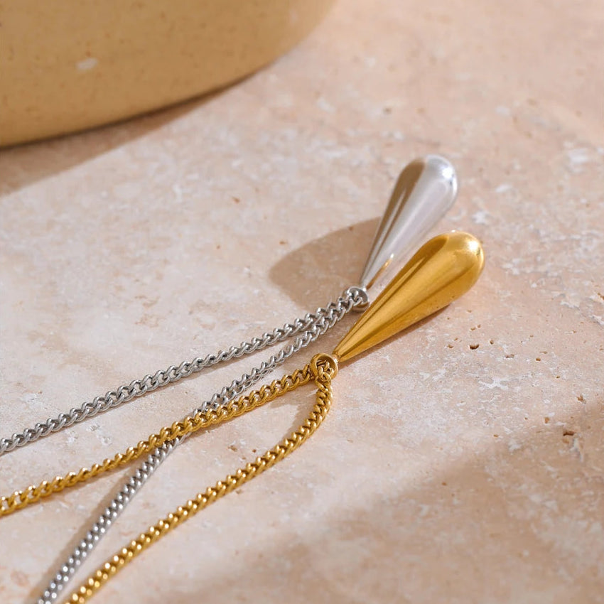 A flat 18ct gold plated medical steel snake chain necklace featuring a single polished gold ball pendant. High-shine finish, hypoallergenic and tarnish-proof.