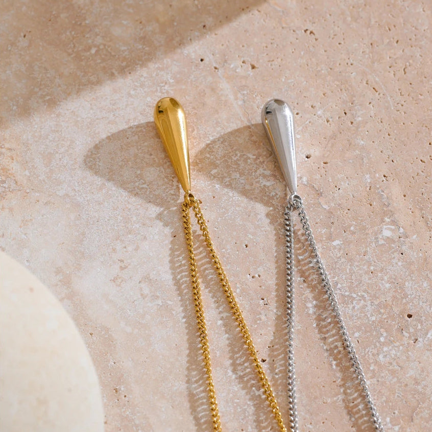 A flat 18ct gold plated medical steel snake chain necklace featuring a single polished gold ball pendant. High-shine finish, hypoallergenic and tarnish-proof.