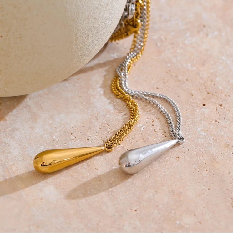 A flat 18ct gold plated medical steel snake chain necklace featuring a single polished gold ball pendant. High-shine finish, hypoallergenic and tarnish-proof.