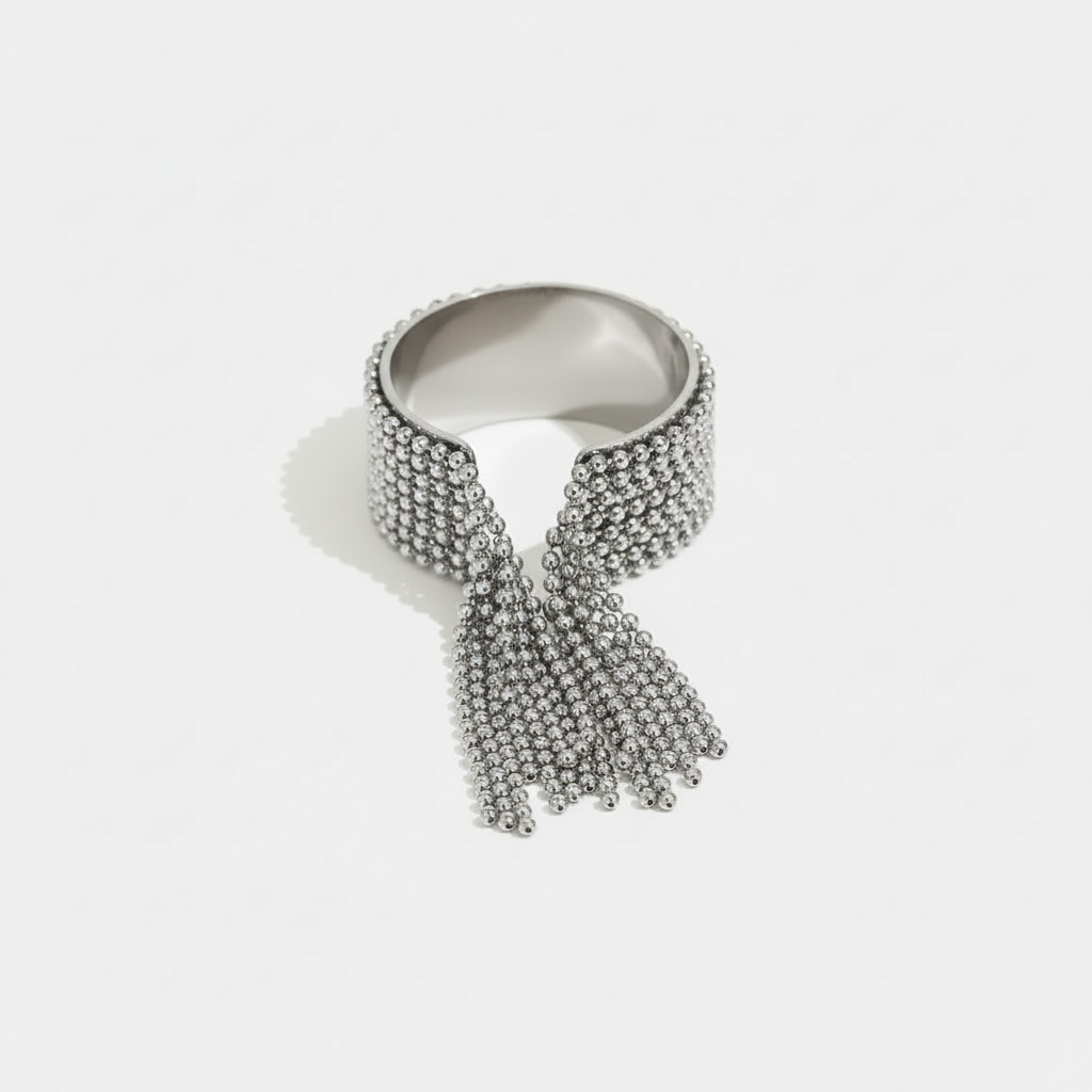 High-shine silver-tone stainless steel ring with a dramatic beaded tassel fringe. Hypoallergenic, tarnish-proof medical-grade steel jewellery.